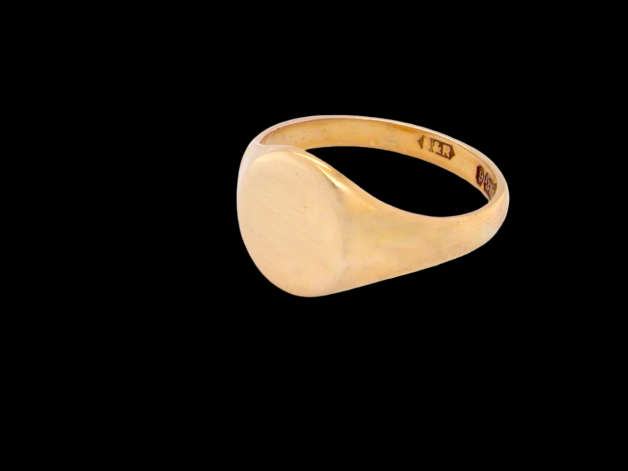 Gold ring on a black background