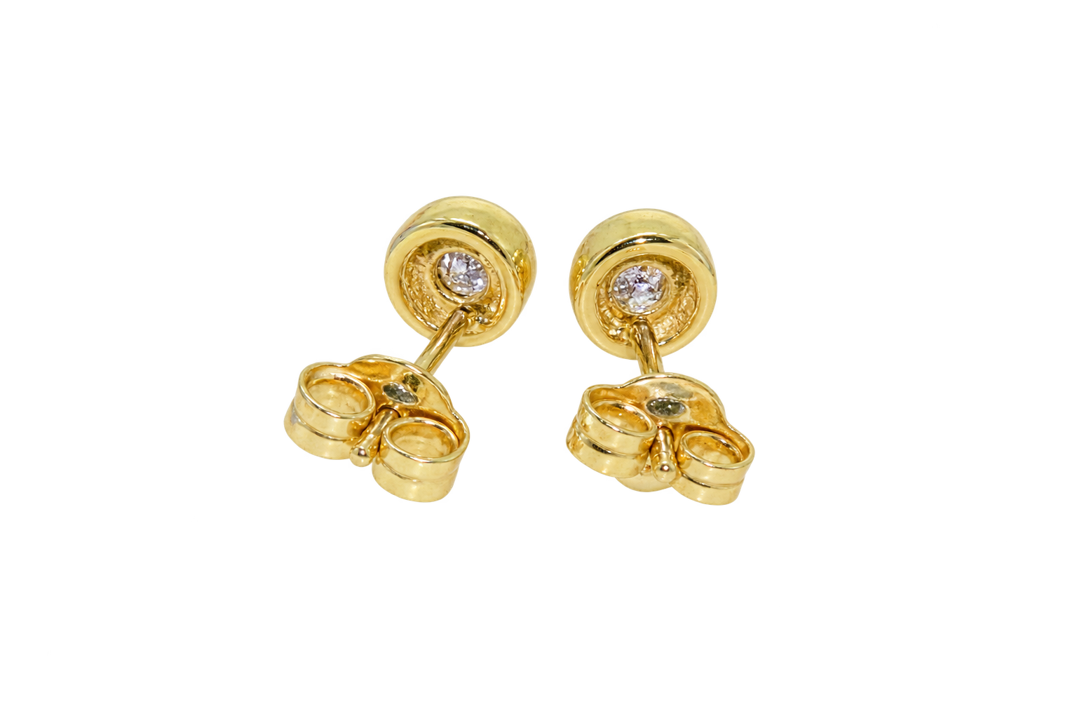 Reverse view of rim set diamond earrings