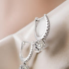 A pair of diamond hoop and drop earrings