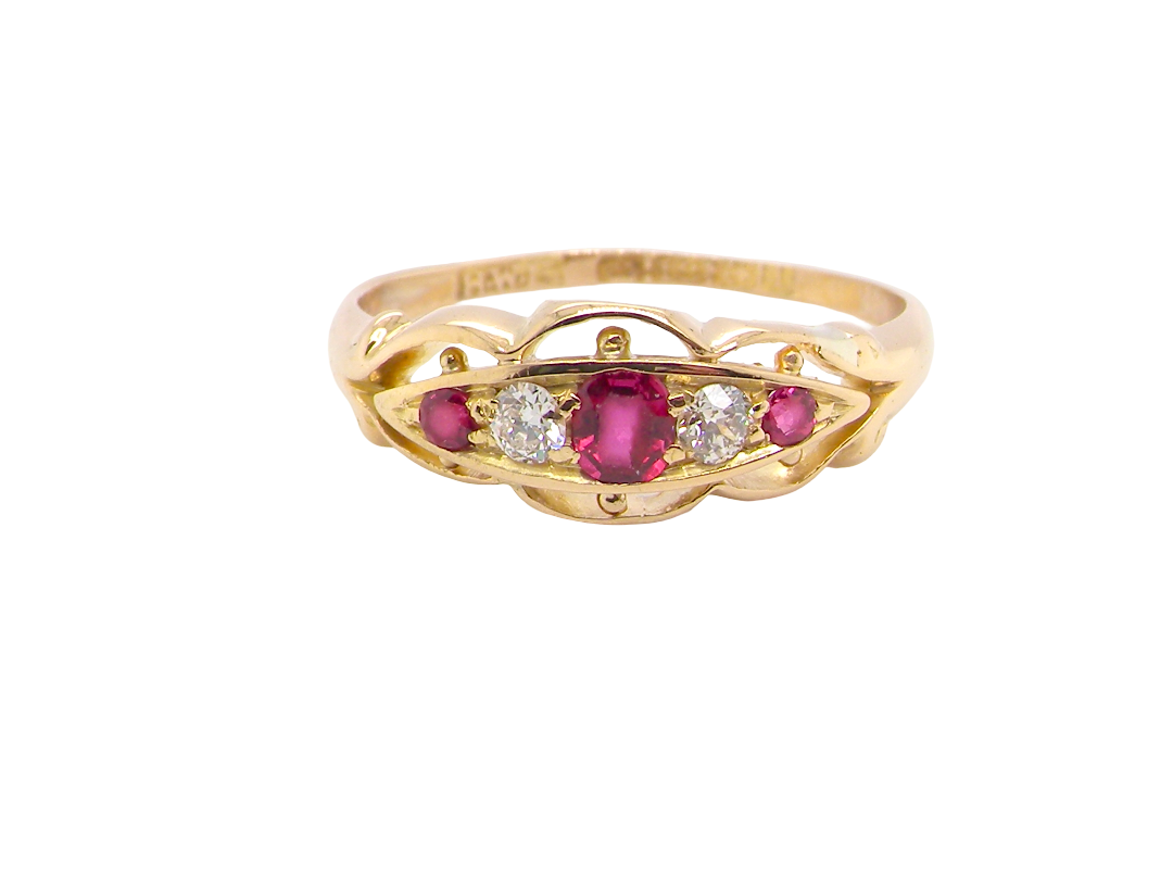 Set with three bright rubies, centre 3x2.6mm, each end a 2mm ruby. Each side of the centre stone an old brilliant cut white diamond 2.8mm (est 0.08 carats) . Head measures 17x7mm, 3.4grams.&nbsp;