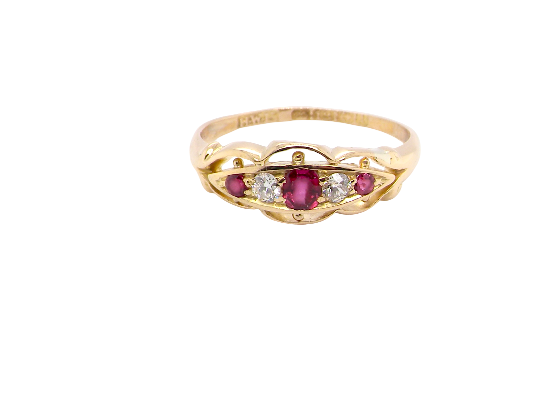 Set with three bright rubies, centre 3x2.6mm, each end a 2mm ruby. Each side of the centre stone an old brilliant cut white diamond 2.8mm (est 0.08 carats) . Head measures 17x7mm, weight 3.4grams.&nbsp;