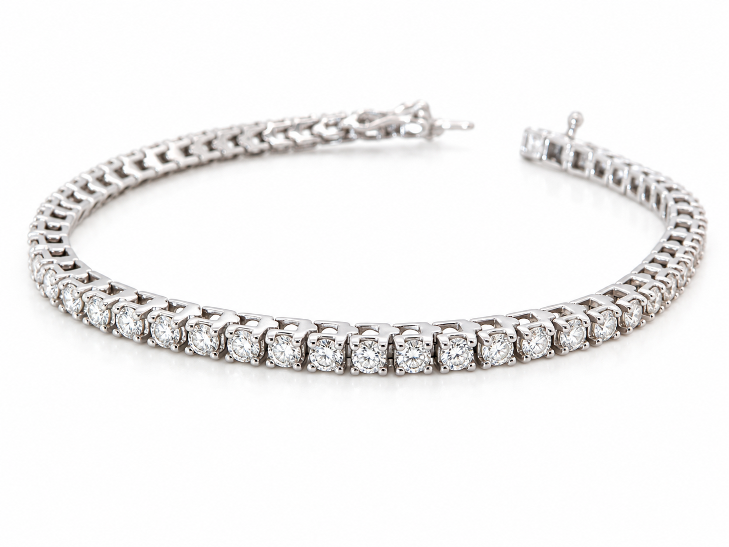 A tennis bracelet set with approximately sixty brilliant cut white diamonds to a total carat weight estimated at 3.50 carats.
