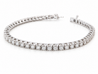 A tennis bracelet set with approximately sixty brilliant cut white diamonds to a total carat weight estimated at 3.50 carats.

