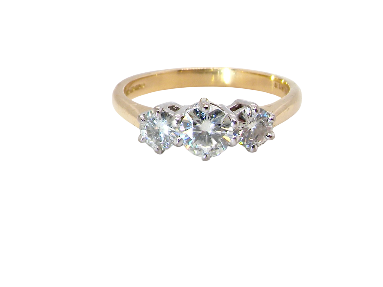 The iconic trilogy ring. This example set with three fine white diamonds