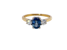 The iconic trilogy ring, featuring an oval cut sapphire centre stone, with a pleasing mid blue hue set into four claws, 7x5mm 