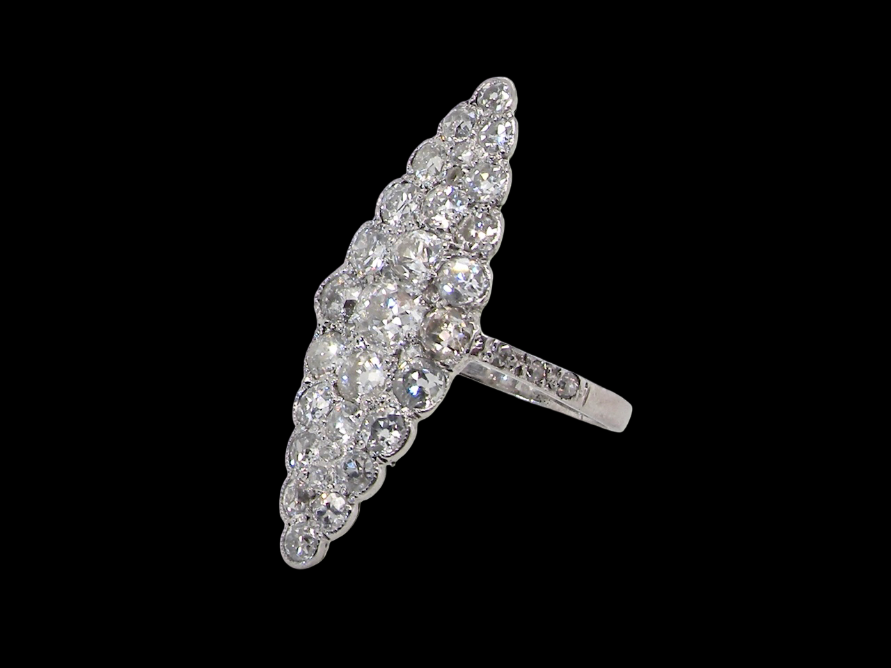 This is a striking marquise-shaped diamond cluster ring  a very classic, vintage-inspired look.