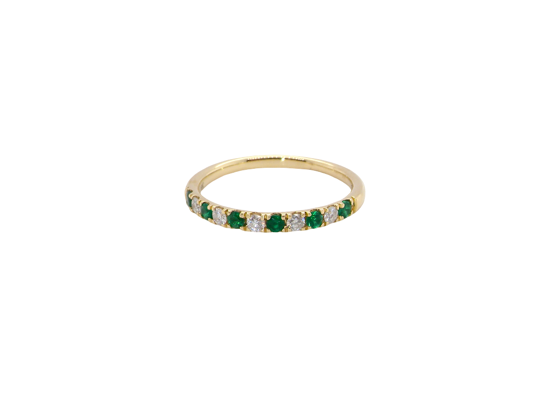 This ring is set with six bright green emeralds, each 2mm, (est 0.25 carats) and five 2mm brilliant cut white diamonds.