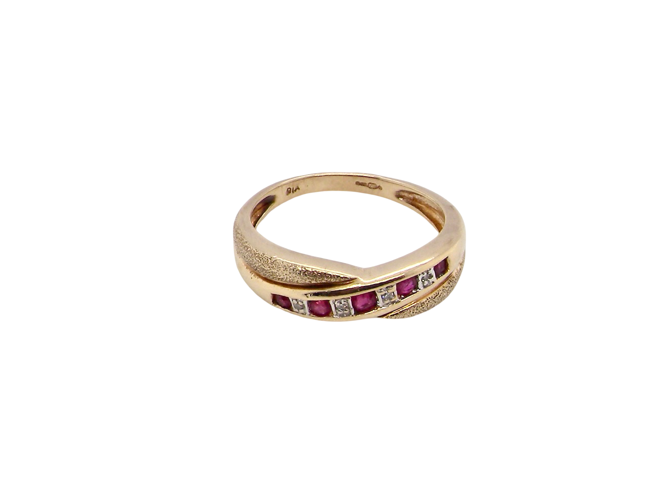 above A 9 carat gold half hoop eternity ring. Set with five calibre cut rubies, from 1.7 to 2mm, and between small 1mm white diamonds.
