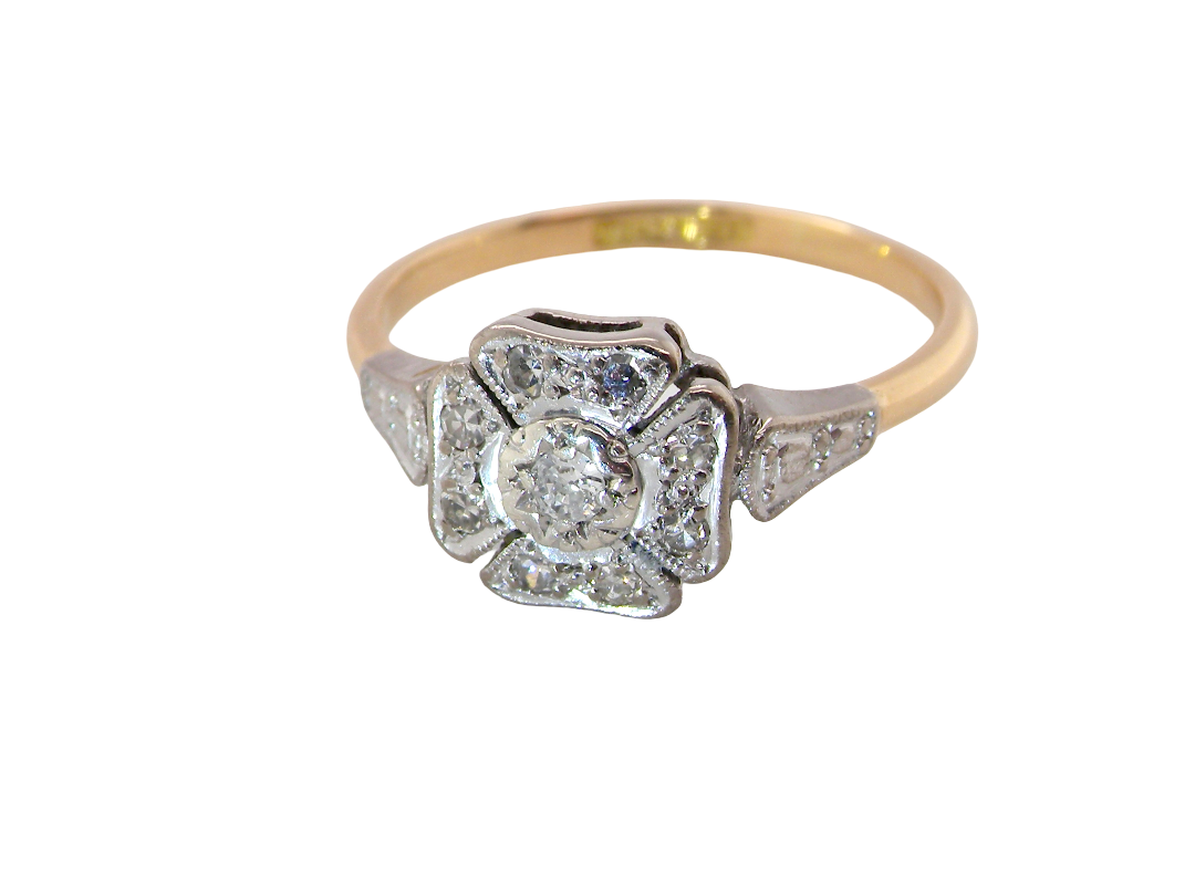 above A vintage diamond cluster ring. Shaped like a four leaf clover, each leaf is pavé set with small white diamonds, two each x 1.5mm. Centre diamond 2.4mm. (total estimated total 0.17 carats)