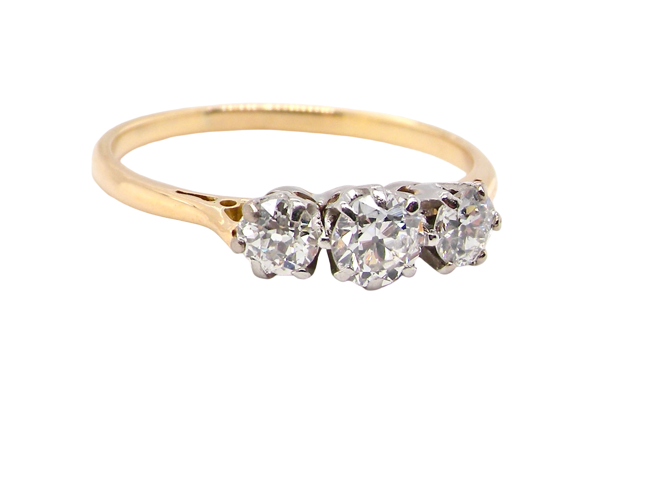 Gold ring with three heart-shaped diamonds on a white background