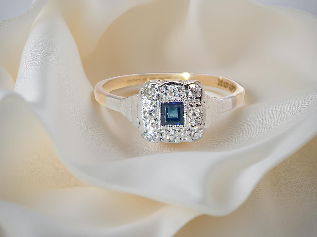 antique cluster ring. small square sapphire