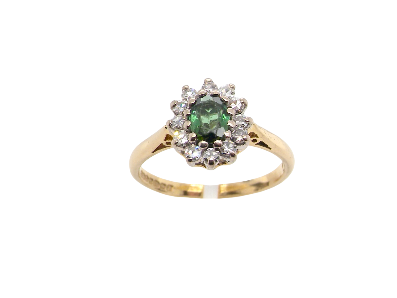 base view An elegant 18 carat gold cluster ring featuring a beautifully proportioned 6 × 4mm green tourmaline 