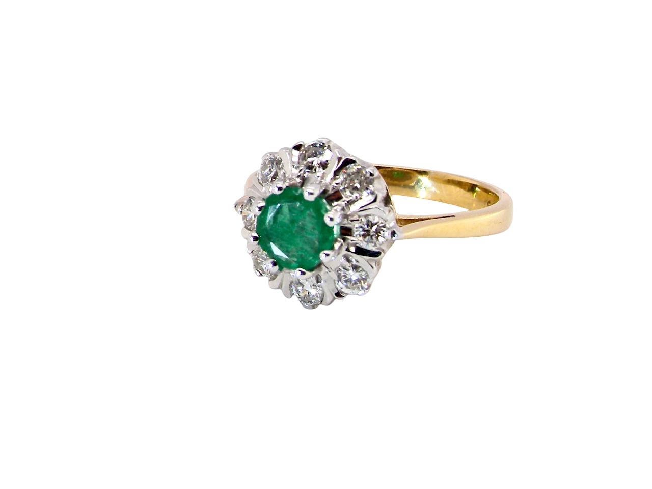  beautiful cluster ring featuring a&nbsp;round emerald 