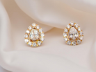 beautiful pair of pear-shaped earrings with brilliant-cut white diamonds.