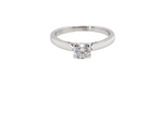 close  beautifully crafted solitaire ring featuring a brilliant-cut white diamond 