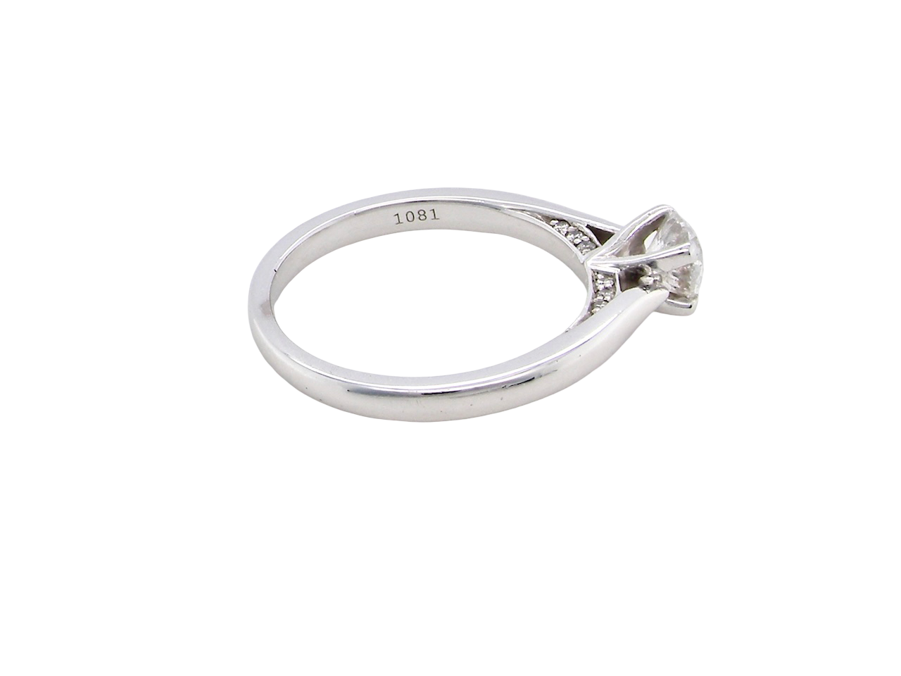 beautifully crafted solitaire ring featuring a brilliant-cut white diamond  side