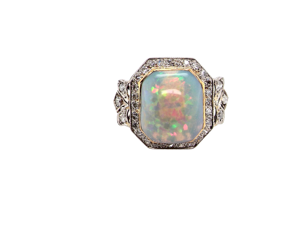 cabouchon cut opal shown is cushion shaped, measures 15x13 (5.78 carats) displaying a mass of vibrant colours, from flashes of fireglow orange, luminous greens, and lavender purples.
