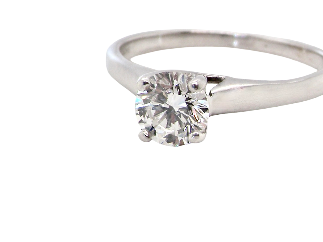 close up  solitaire ring containing a fine modern brilliant cut white diamond. Measures 5.4mm (.53 carats)

Colour G-h, clarity Si. Modern feature under setting, depth 6.8mm, weight 2.6grams.
 