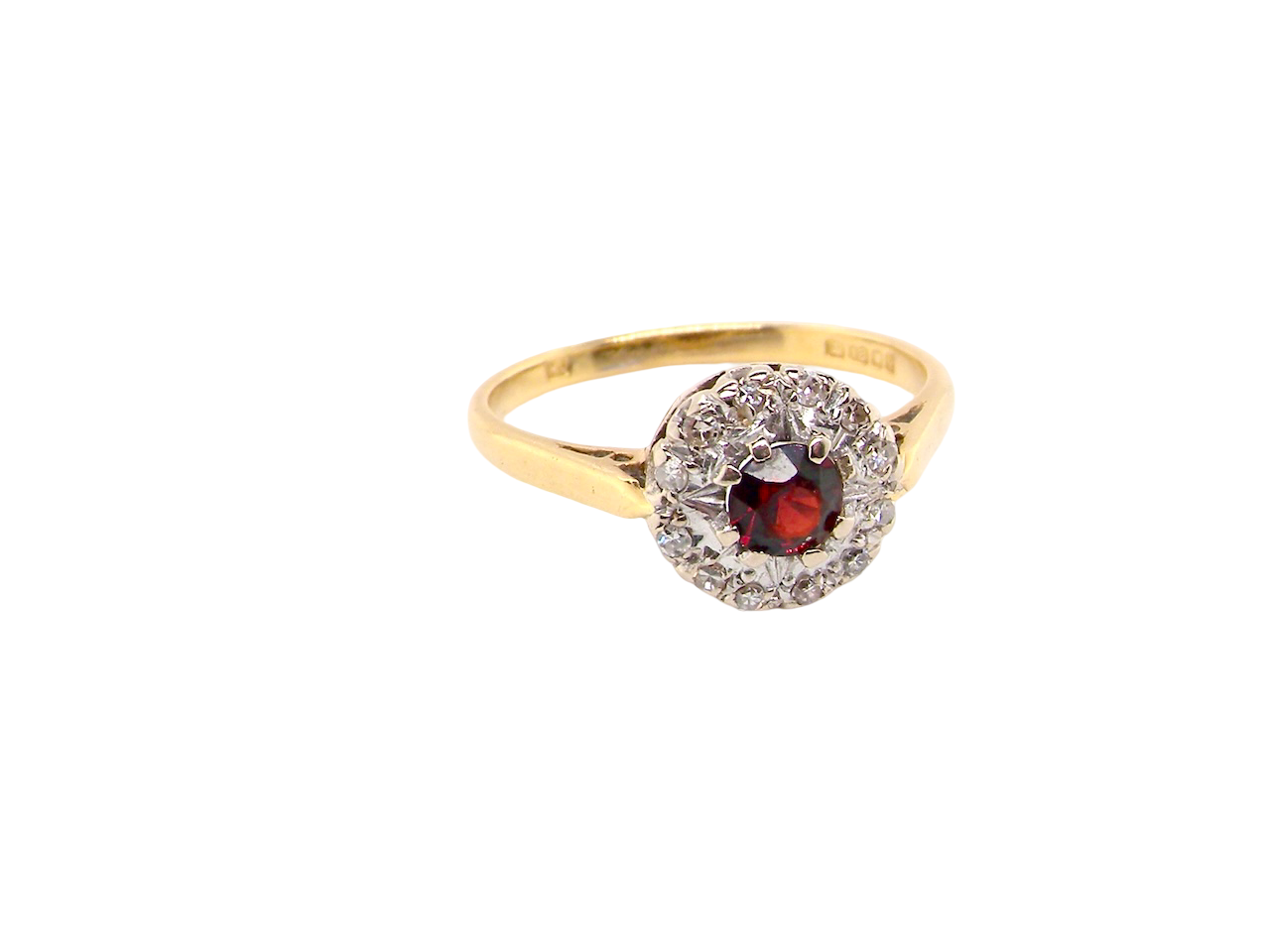  classic 1960s 18 carat yellow gold ring, featuring a round garnet 