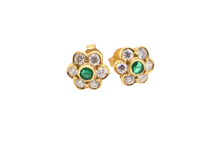  classic cluster earrings, each featuring a&nbsp;round emerald 