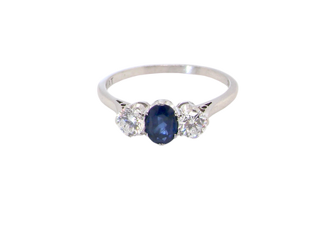  classic trilogy ring set with an exquisite oval cut sapphire centre stone, hues of deep&nbsp; blue colour and measuring 6x4.2mm (est approx 0.50 carats) 