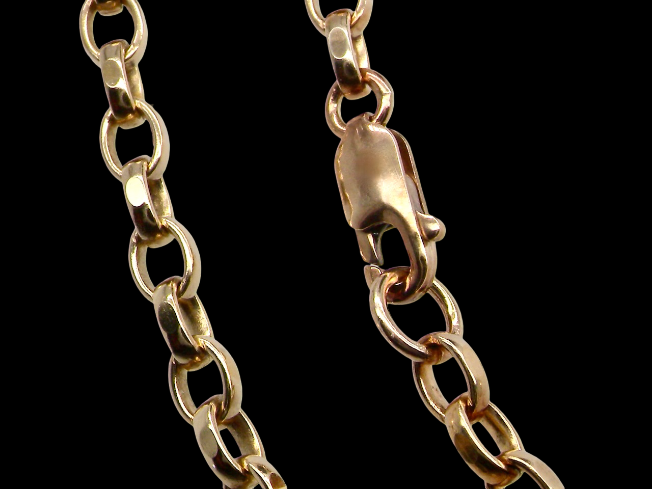 Gold chain with a clasp on a black background