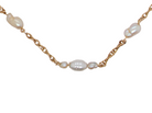 A gold chain necklace featuring irregular white baroque pearls spaced along the chain, shown against a plain white background.
