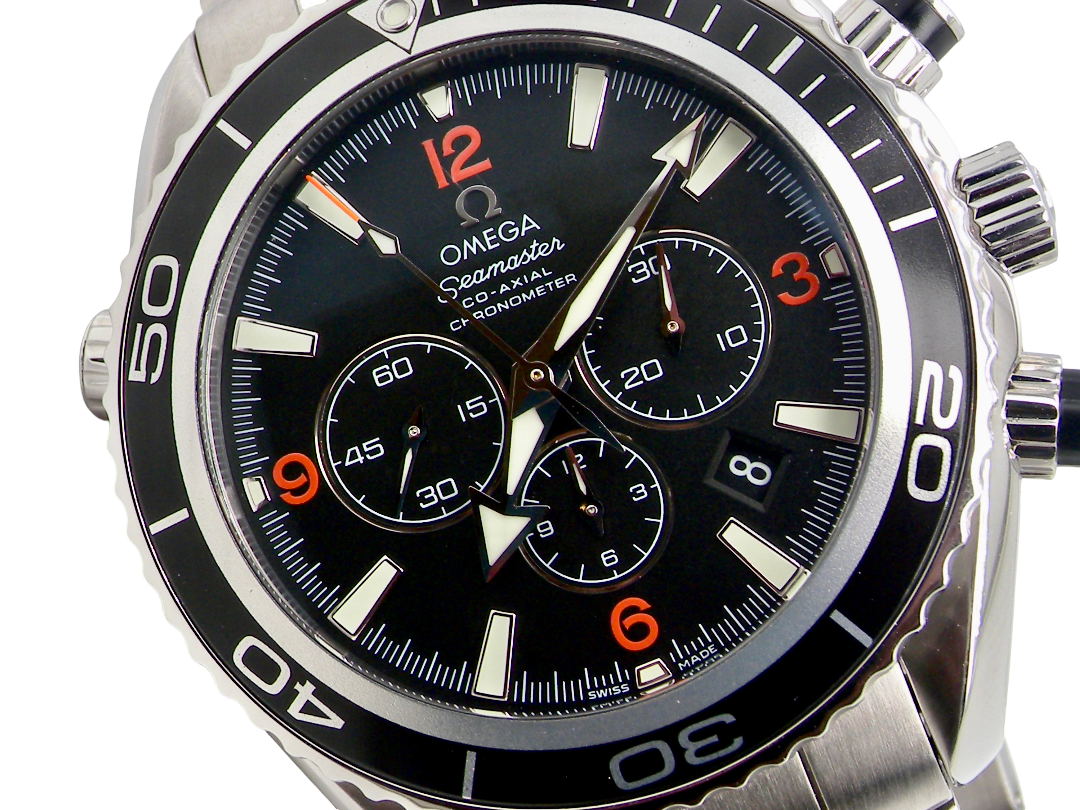 Omega Seamaster Co-Axial Chronograph watch with a black dial, silver stainless steel case, and a black rotating bezel with orange numerals.