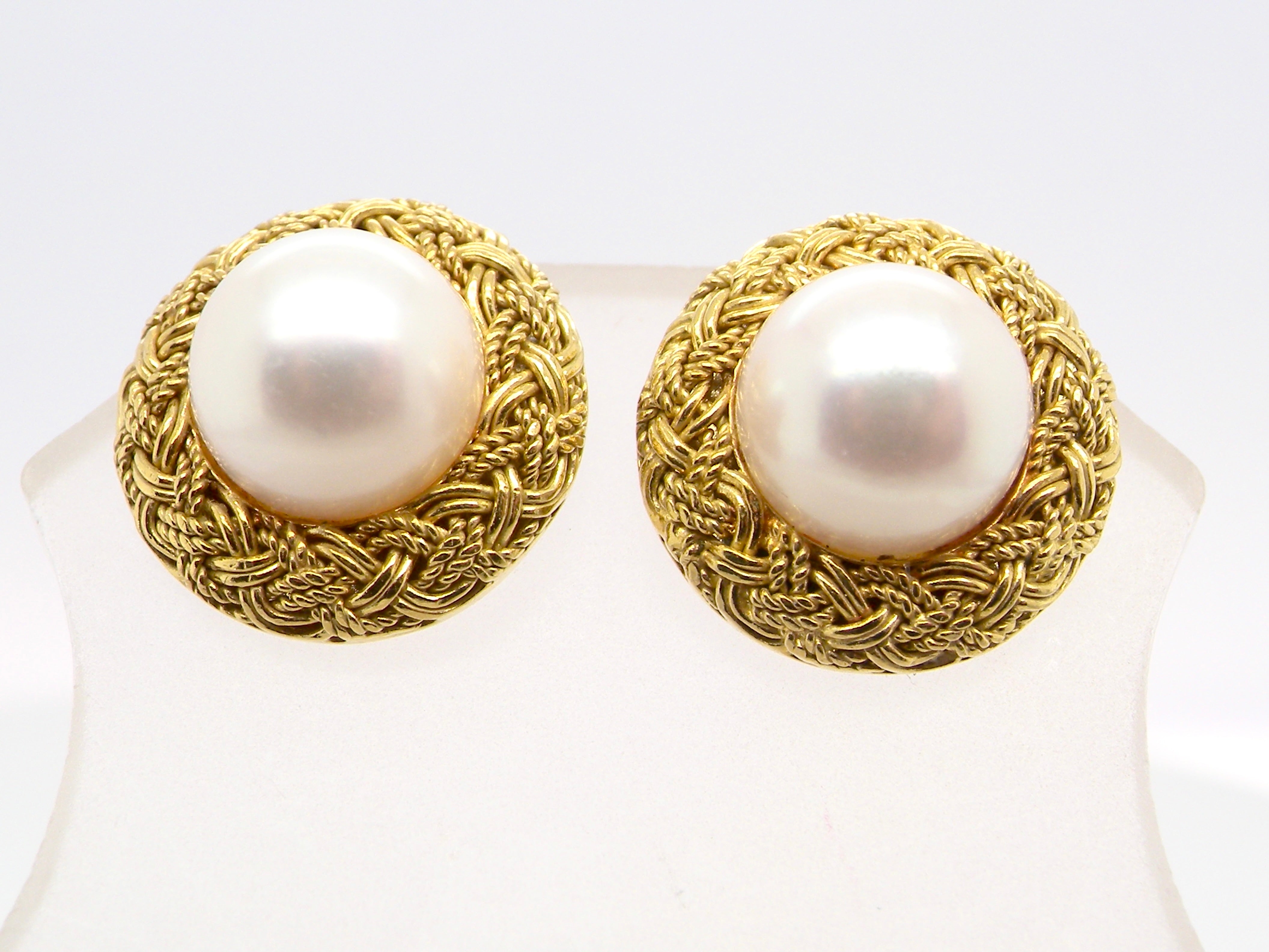 close view A lovely pair of elegant earrings, each set with a 7.7 mm cultured pearl.