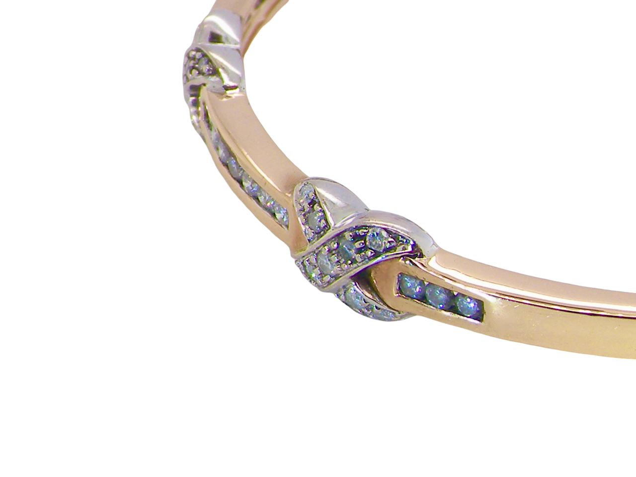 close view An impressive 9 carat gold bangle.&nbsp;

Three 'kiss' shaped sections , each set with nine brilliant cut white diamonds