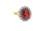 A fine cluster ring. Features a large garnet centre stone&nbsp;

Complimented by an outer halo of brilliant cut diamonds.&nbsp;