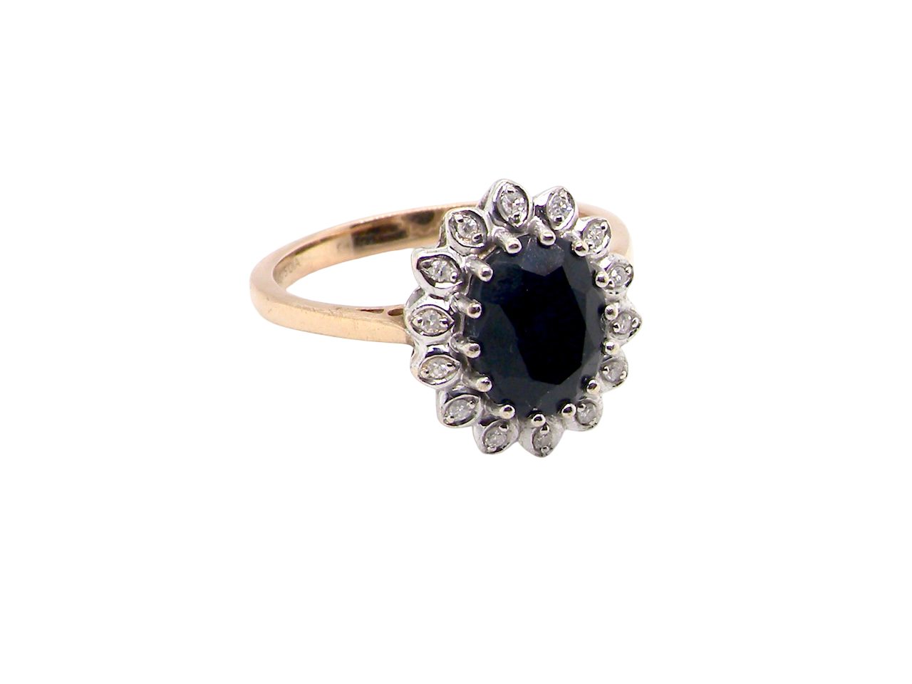  cluster ring featuring a deep ink-black blue sapphire 