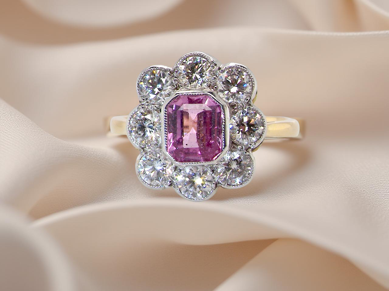  cluster ring featuring a beautiful cushion-cut pink sapphire  B