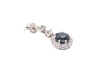  drop earring crafted in 18 carat white gold, each set with a striking inky blue-black sapphire measuring 7.5mm in diameter.