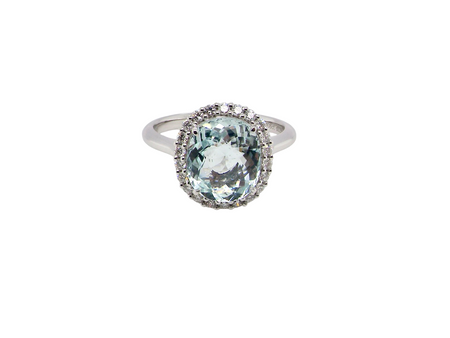 elegant cluster ring centred on a beautiful oval aquamarine, 