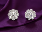 elegant pair of 18 carat gold* cluster earrings, each beautifully set with  white diamonds.