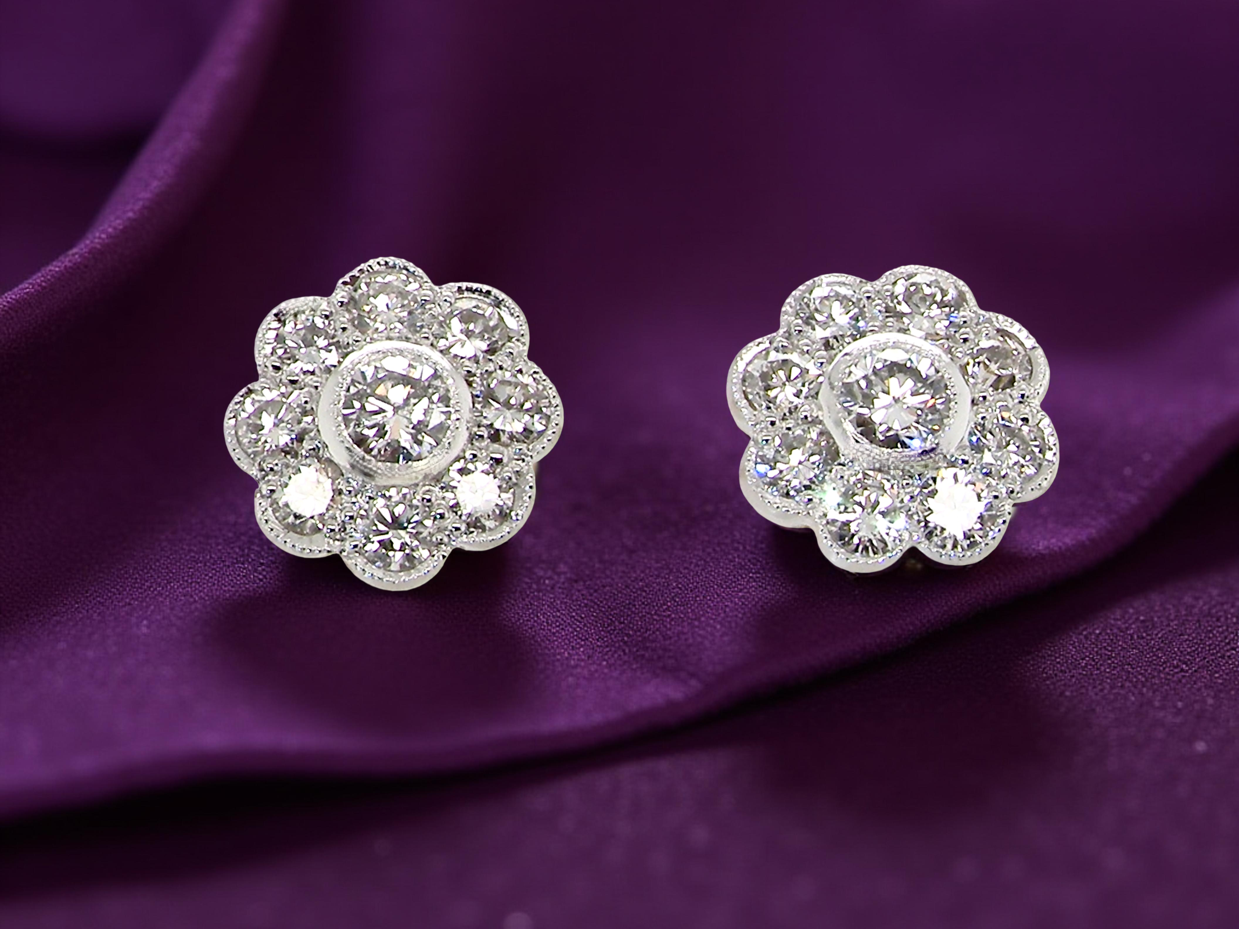 elegant pair of 18 carat gold* cluster earrings, each beautifully set with  white diamonds.