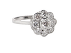 elegant vintage cluster ring crafted in platinum* and set with a diamond centre stone,&nbsp;