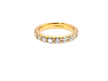 eternity ring is crafted in 18ct gold and set with fourteen round brilliant-cut white diamonds.