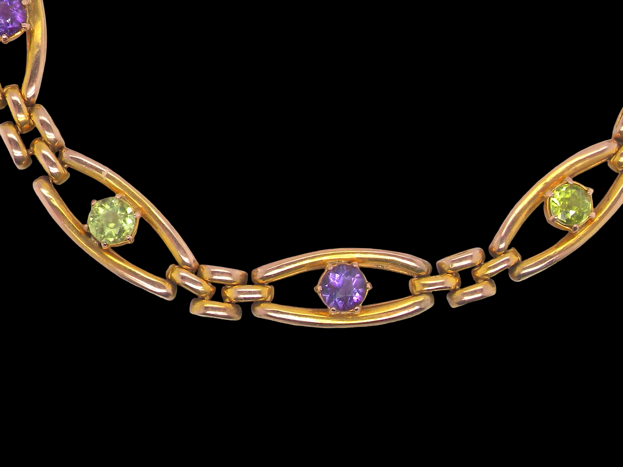exquisite early 20th century bracelet set with  peridot and amethyst stones,