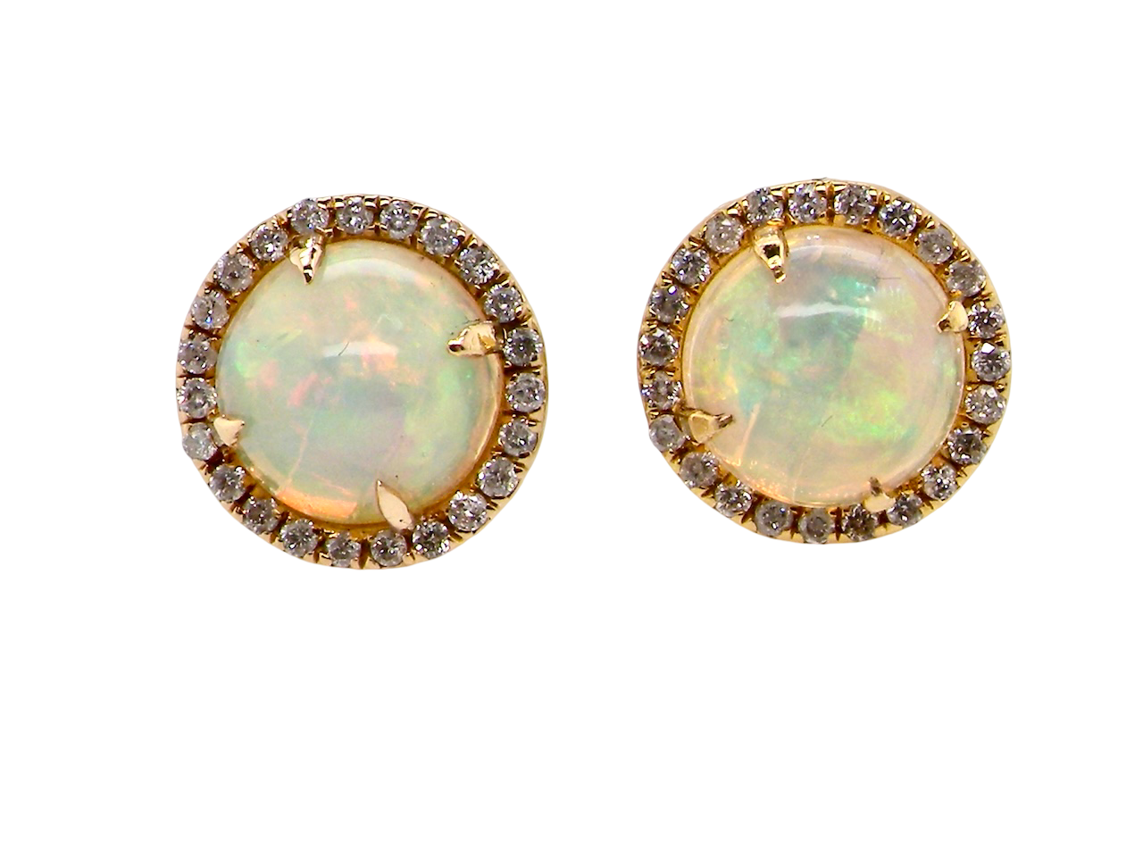 An exquisite pair of opal and diamond earrings