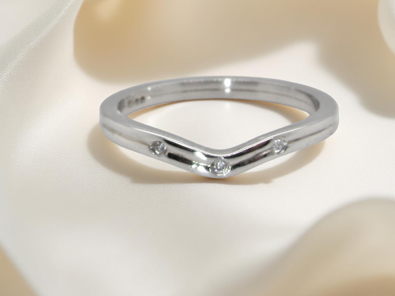 A diamond wishbone ring