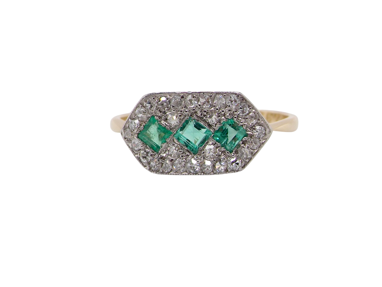  fine Edwardian era cluster ring, beautifully handcrafted with a trio of vibrant emeralds surrounded by a halo of old-cut diamonds. 