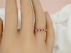 An 18 carat Ruby and Diamond eternity ring