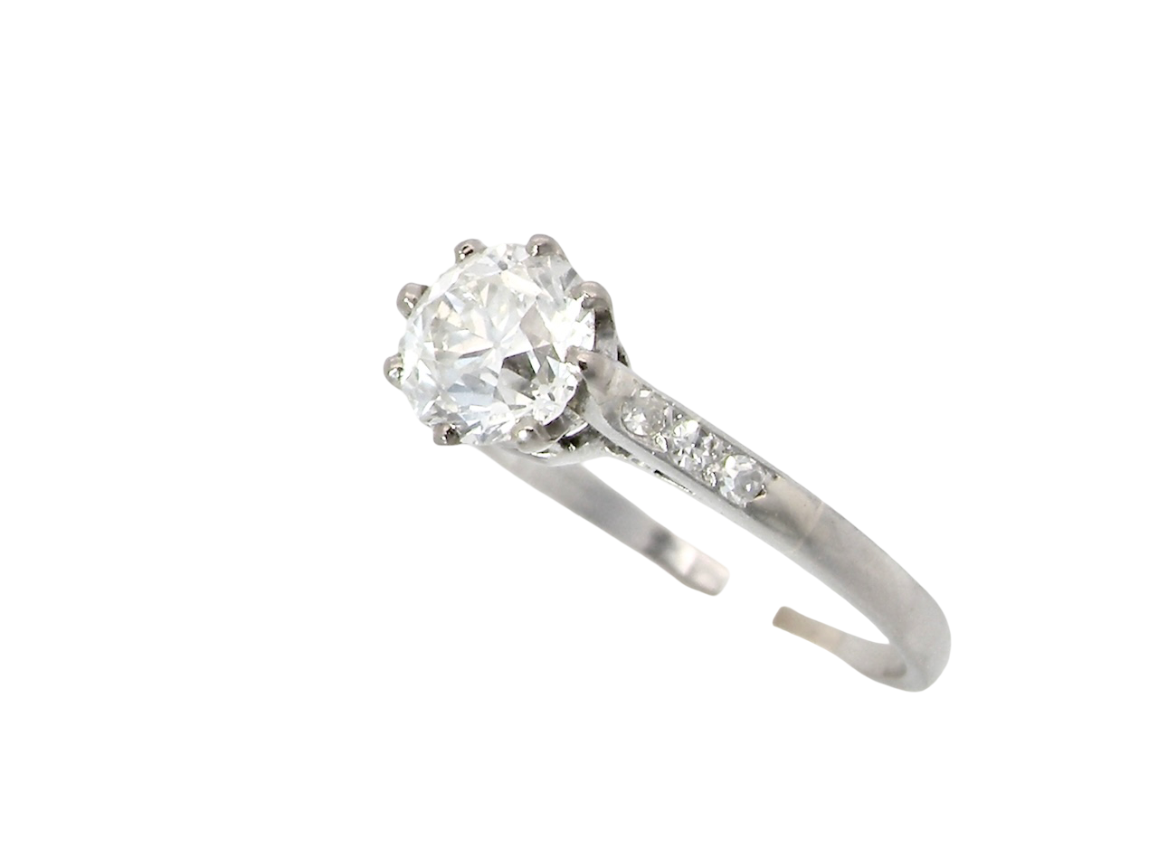 from the side A timeless vintage solitaire ring set with a striking old brilliant cut white diamond. The central diamond measures approximately 6mm, estimated at 0.75 carat, with colour graded between G–I and clarity SI.