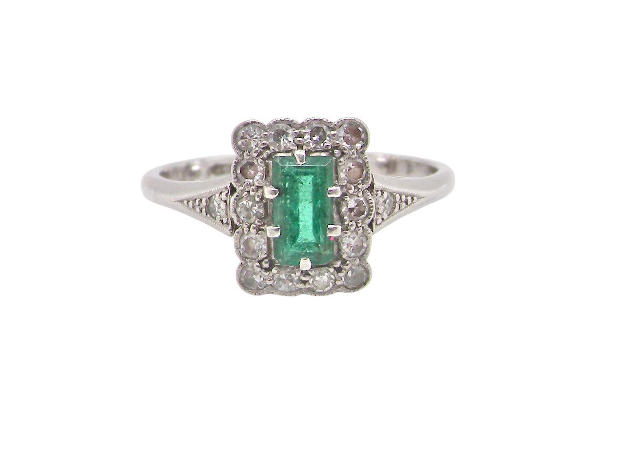 A vintage Emerald and Diamond Cluster ring