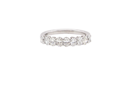 gorgeous half-hoop eternity ring set with nine oval brilliant-cut white diamonds.