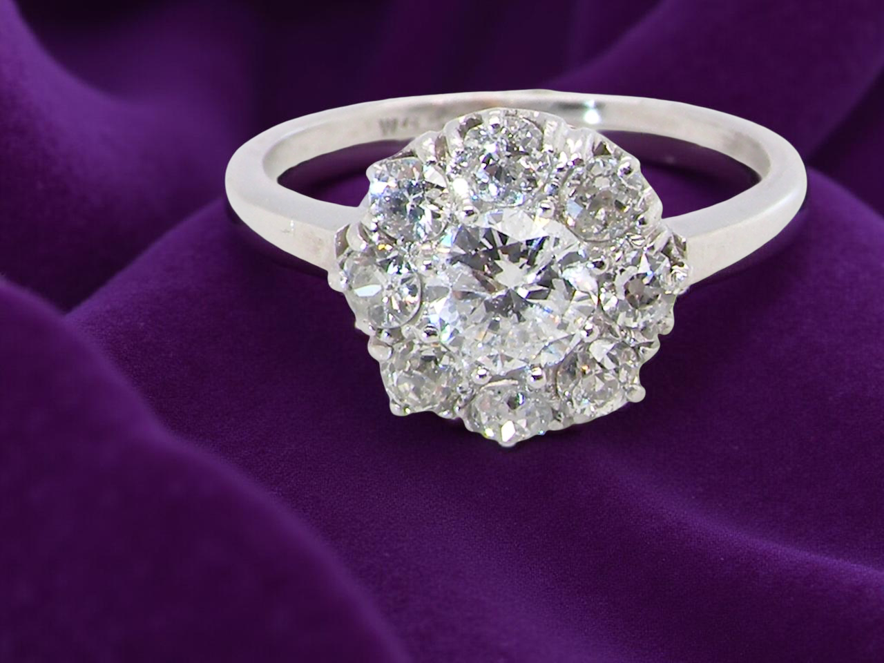  gorgeous vintage  ring that has as its principal setting&nbsp; an old brilliant cut white diamond, 