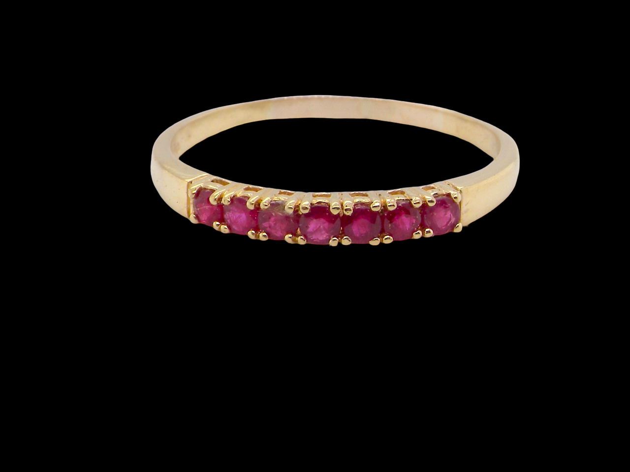 A half hoop ruby eternity ring