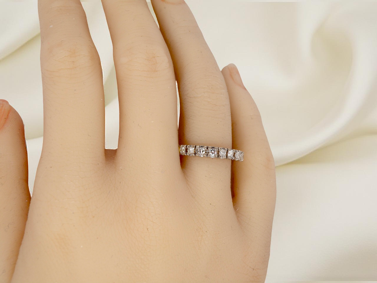 hand  1970s vintage half-hoop eternity ring, tested as 18 carat gold and elegantly set with nine brilliant-cut white diamonds. 